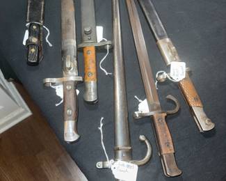 WWII and other bayonets and swords.