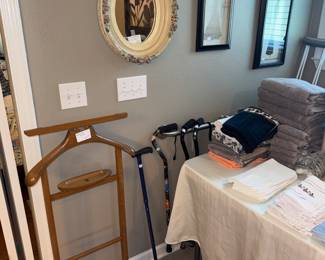 Vintage gentleman’s valet, towels, walking sticks
