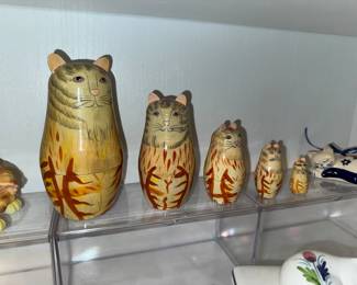 I have seen nesting dolls but never nesting cats.