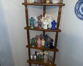 Two shelves full of Fenton angels