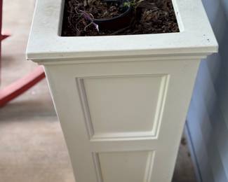Two taller non-wood planters that match the other four planters
