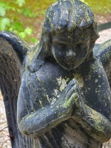 Outdoor concrete angel statue
