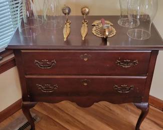 Mahogany lowboy brass, wall sconces and glass globes