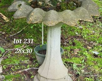 Concrete bird bath with pig