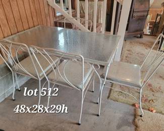 Vintage glass top iron patio table and chairs