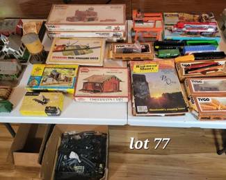 Large collection of HO scale trains, tracks and various buildings