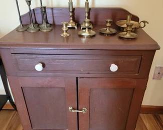 Vintage washstand and assortment of brass candlesticks