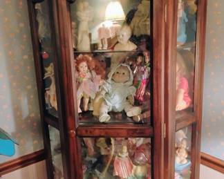 CURIO CABINET FULL OF VINTAGE DOLLS
