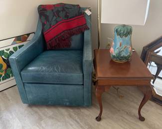 Blue leather swivel chair, side table