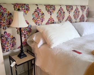 King size upholstered headboard, pair iron side tables and buffet type lamps