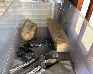 Various rocks and obsidian artifacts.