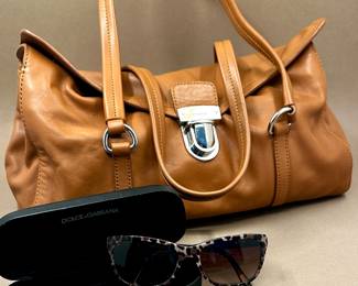 Prada handbag. Dolce & Gabbana sunglasses.