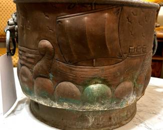 Large copper log bucket, England, circa 1880s. Lions head handles. Hand hammered Viking ships, deep collared base.