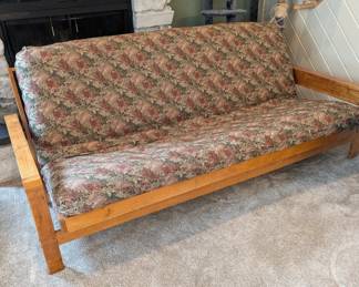 Woodframe Futon with Mattress and extra cream cover. This makes a GREAT extra bed!
