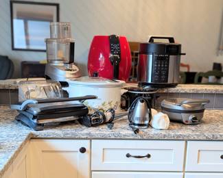 Kitchen appliances - includes air fryers, large food processer, panini press, croc pots x2 (1 large, 1 small), immersion blender, waffle maker, pressure cooker