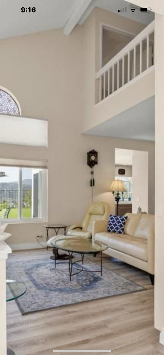 Wall clock is NOT available... Contemporary Leather couches and chairs. Glass top end tables. Area rugs and More. Stay tuned for updated photos as prepare for you! :)