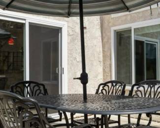 Like NEw Wrought Iron Patio table, chairs, unbrella, and stand!! Great for backyard chillaxin with friends and family. :)
