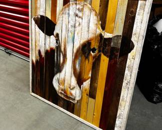 Large, wooden cow painting