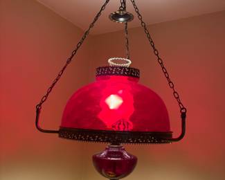 Converted oil lamp-cranberry colored oil lamp, converted to swag hanging electric light