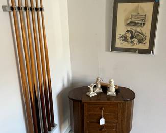 Pool sticks vintage and an antique sewing box w/ tchotchkes 70's figurines..