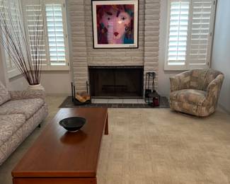 Foreground: teak coffee table. Background: Acrylic art by Jack Shultz and a recovered MCM sofa & swivel/bucket chair.