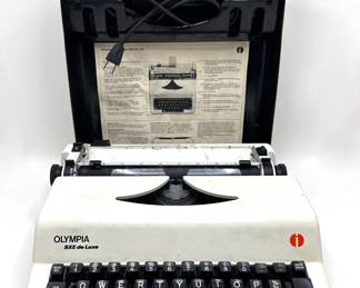 Vintage 1980s Olympia SXE De Luxe Portable Electric Typewriter In Carrying Case, West Germany
Lot #: 123
