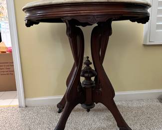 R14 - $225 - Victorian Walnut side table w/ oval marble top. Measuring 29W x 21D x 30T