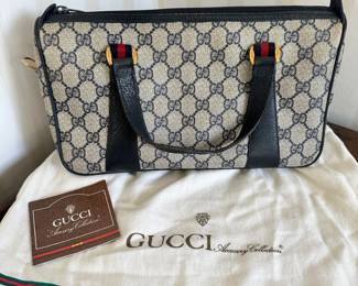 R87 - $300- Vintage GG Supreme Top Handle Bag. See photos for acknowledged stain / wear. Easy to clean.