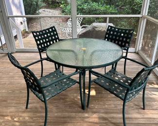 R36 - $75 - Patio Set with Glass Top Table and 4 Chairs. Surface rust.