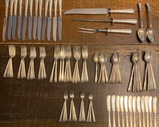 RS1 - $2750 (or Highest Offer) Weight Available Upon Request. Sterling Silver Flatware Set. "Treasure" Sterling. Includes 10 Iced Tea Spoons, 11 Spoons, 12 Cocktail Forks, 12 Knives, 12 flat butter knives, 13 Dinner Forks, 13 Salad Forks, 3 Pc Carving Set, 2 Serving Spoons.
