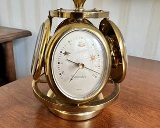 R30 - $250 - Rare 1950s Remembrance Swiss Brass Weather Station Desk Clock. Serves as a thermometer, barometer, and hygrometer. Sits about 5"tall.