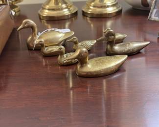 R99 - $35 - (7) Brass Ducks