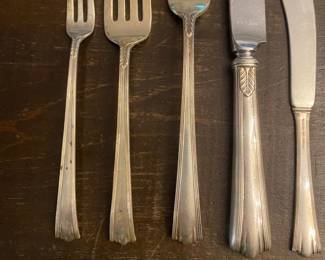 RS1 - $2750 (or Highest Offer) Weight Available Upon Request. Sterling Silver Flatware Set. "Treasure" Sterling. Includes 10 Iced Tea Spoons, 11 Spoons, 12 Cocktail Forks, 12 Knives, 12 flat butter knives, 13 Dinner Forks, 13 Salad Forks, 3 Pc Carving Set, 2 Serving Spoons.
