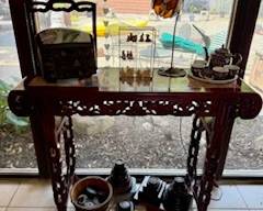 Retired Wee Forest Folk and Wee Sea Folk on a granite topped rosewood console table