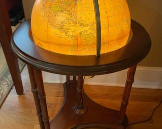 Illuminated globe on wooden base