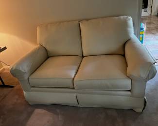 #13 cream bassett love seat, detached back 65" long $75.00