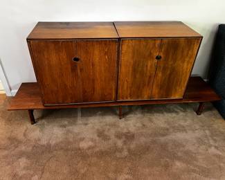 #31 mid century cabinet on pedestal 4 doors, 4 drawers, pull out shelf, as is finish 26x17x24 (two of them), base is 74" wide $300.00