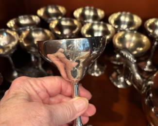 Large set of sterling champagnes with gold washed bowl