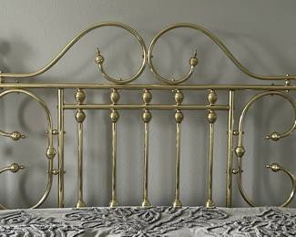 Brass headboard.