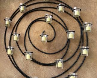 Black candle wall hanging.