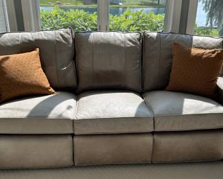 Arhaus leather couch with left and right retractable foot stool
