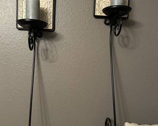 Black candle wall hangings.