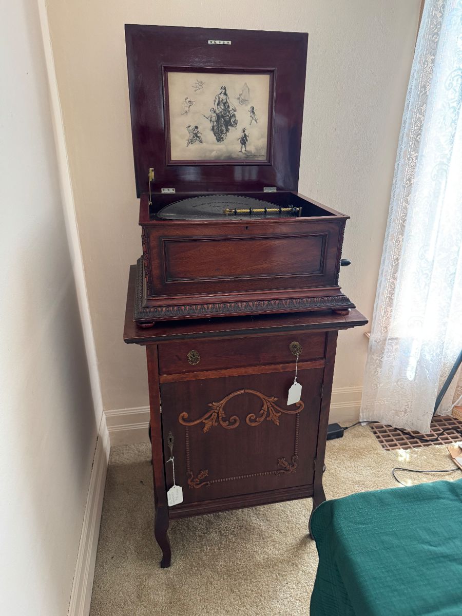 Regina music box, cabinet, and discs sold separately. c.1890 