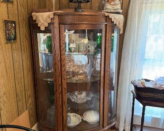 curved China cabinet, silver plate cruet set.
