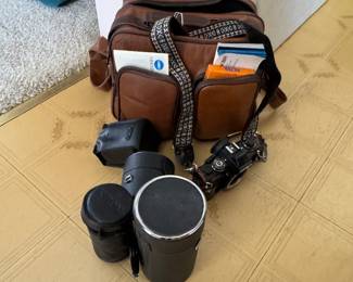 Minolta camera, bag and assorted lenses