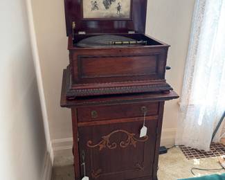 Regina music box, cabinet, and discs sold separately. c.1890