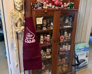 Hershey collectibles and another bookcase or China cabinet, and Mr. bones