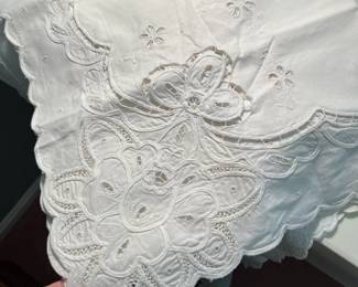 Collection of vintage and antique lace table clothes and runners