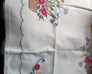 Collection of vintage and antique lace and embroidered table clothes and runners