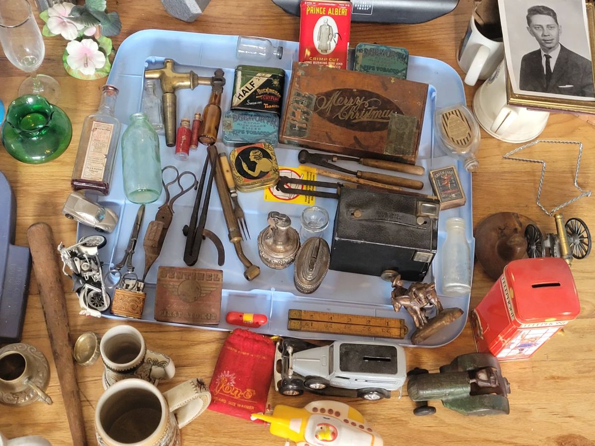Various small collectibles including a cigar box, a camera, lighters, coin banks, mugs, bottles and jars, lighters, Half & Half tobacco & Prince Albert cans and more!